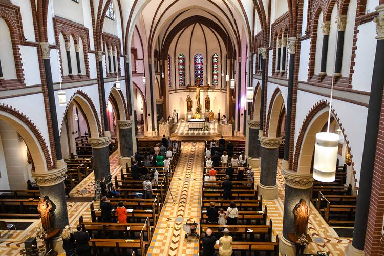 People attend Mass in late June at a church in Bonn, Germany. (CNS photo/Harald Oppitz, KNA)