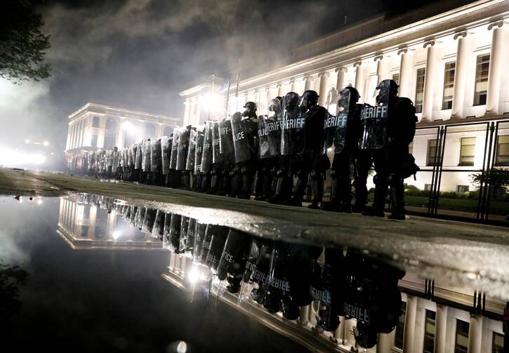 Law enforcement officers are seen in Kenosha, Wis., on Aug. 25, two nights after the police shooting of Jacob Blake. (CNS photo/Brendan McDermid, Reuters)