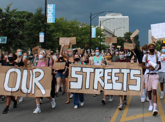 A student protest at Loyola University Chicago. Photo courtesy of Our Streets LUC (ourstreetsluc.org); Photo by Christian Yeomans.