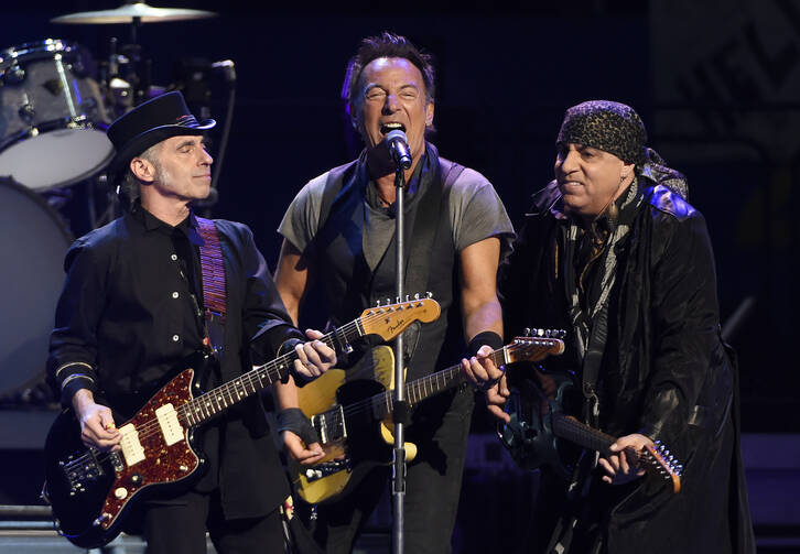 Bruce Springsteen performs with Nils Lofgren, left, and Steven Van Zandt of the E Street Band during their concert at the Los Angeles Sports Arena in Los Angeles, March 15, 2016. (Photo by Chris Pizzello/Invision/AP, File)