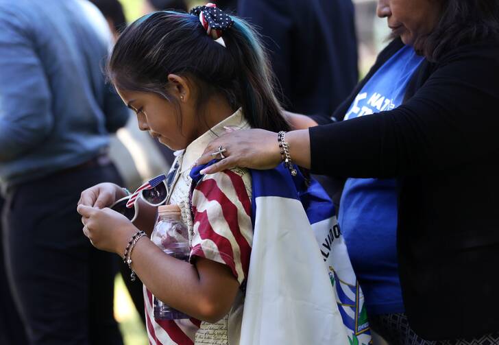 Marilyn Miranda, 9, draped in a Salvadoran flag, attends an immigration rally with her mother outside the U.S. Capitol in Washington June 4, 2019. A Sept. 14, 2020, decision from the U.S. Court of Appeals for 9th Circuit in Ramos v. Nielsen brings the Trump administration one step closer to ending Temporary Protected Status, or TPS, for almost all people with TPS in the United States. (CNS photo/Leah Millis, Reuters)