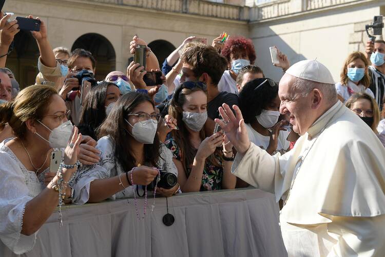 Pope Francis greets the crowd as he arrives for his general audience in the San Damaso courtyard at the Vatican Sept. 16, 2020. (CNS photo/Vatican Media)