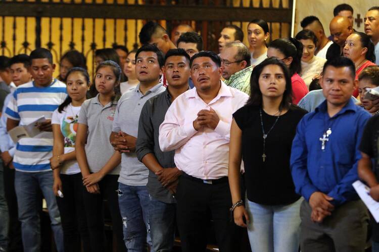 Participants pray during Mass at the Labor Day Encuentro gathering at Immaculate Conception Seminary in Huntington, N.Y., Sept. 3, 2018. (CNS photo/ Gregory A. Shemitz, Long Island Catholic)