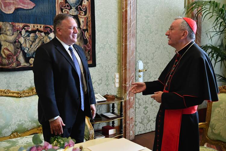 U.S. Secretary of State Mike Pompeo talks with Cardinal Pietro Parolin, Vatican secretary of state, during a meeting at the Vatican Oct. 1, 2020. (CNS photo/Vatican Media)