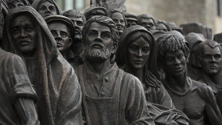 The sculpture "Angels Unawares" is seen at The Catholic University of America in Washington on Sept. 27, before touring the United States over the next year. The life-size sculpture, which depicts a group of migrants and refugees crowded on a boat, is a replica of the one Pope Francis unveiled in St. Peter’s Square at the Vatican during the 2019 World Day of Migrants and Refugees. (CNS photo/Tyler Orsburn)