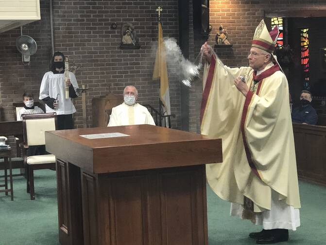  New Orleans Archbishop Gregory M. Aymond uses incense to reconsecrate Sts. Peter and Paul Church and the church's altar in Pearl River, La., Oct. 10, 2020. (CNS photo/Christine Bordelon, Clarion Herald)
