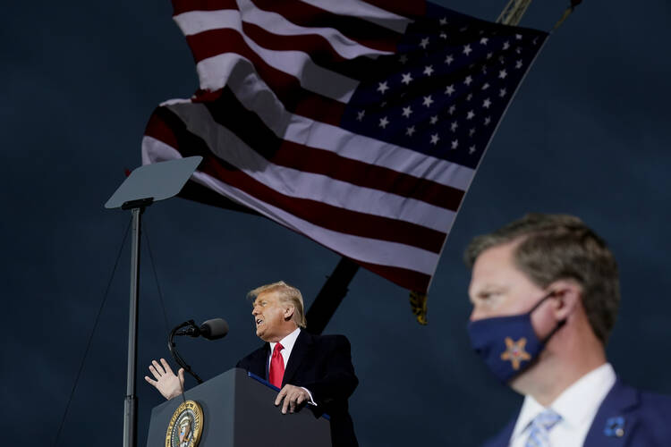President Donald Trump speaks at a campaign rally at Des Moines International Airport on Oct. 14, in Des Moines, Iowa. (AP Photo/Alex Brandon)