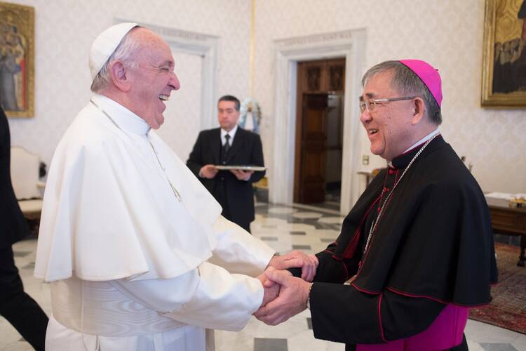 Pope Francis greets Bishop Cornelius Sim, apostolic vicar of Brunei, during his "ad limina" visit to the Vatican in this Feb. 8, 2018, file photo. Bishop Sim was among 13 new cardinals named by Pope Francis Oct. 25. (CNS photo/Vatican Media)