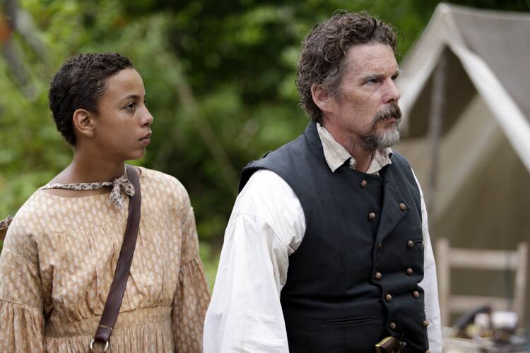 Joshua Caleb Johnson and Ethan Hawke in “The Good Lord Bird” on Showtime. (CNS photo/William Gray, Showtime)