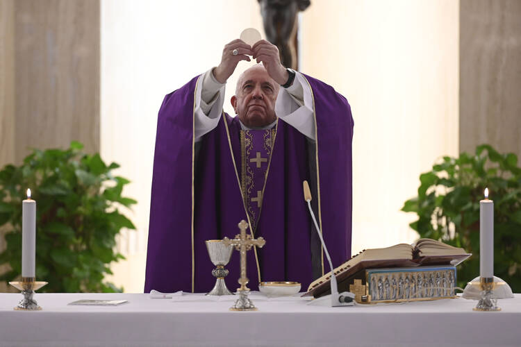 Pope Francis celebrates Mass on March 12, 2020, in the chapel of his Vatican residence, the Domus Sanctae Marthae. At the beginning of the liturgy, the pope encouraged people to pray for their government leaders, who must make difficult decisions to contain the coronavirus pandemic. (CNS photo/Vatican Media)