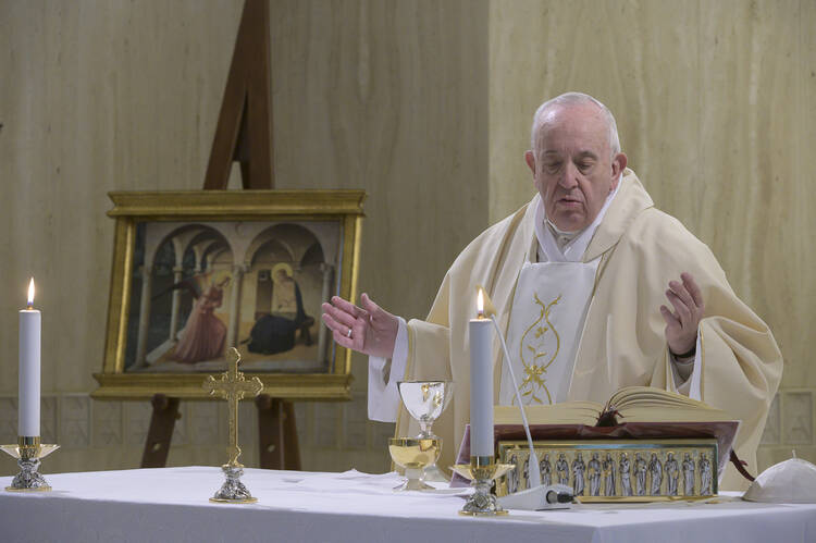  Pope Francis celebrates Mass on the feast of the Annunciation, March 25, 2020, in the chapel of the Domus Sanctae Marthae at the Vatican. (CNS photo/Vatican Media)