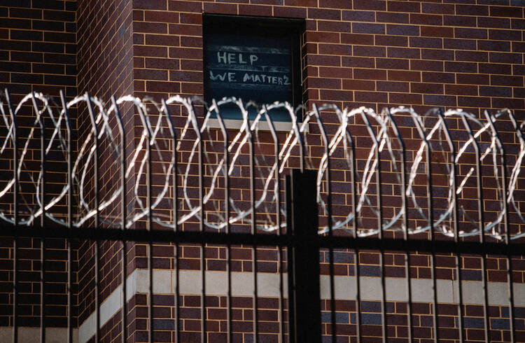 Signs made by Cook County Jail prisoners in Chicago plead for help April 7, 2020, during the coronavirus pandemic. (CNS photo/Jim Vondruska, Reuters)