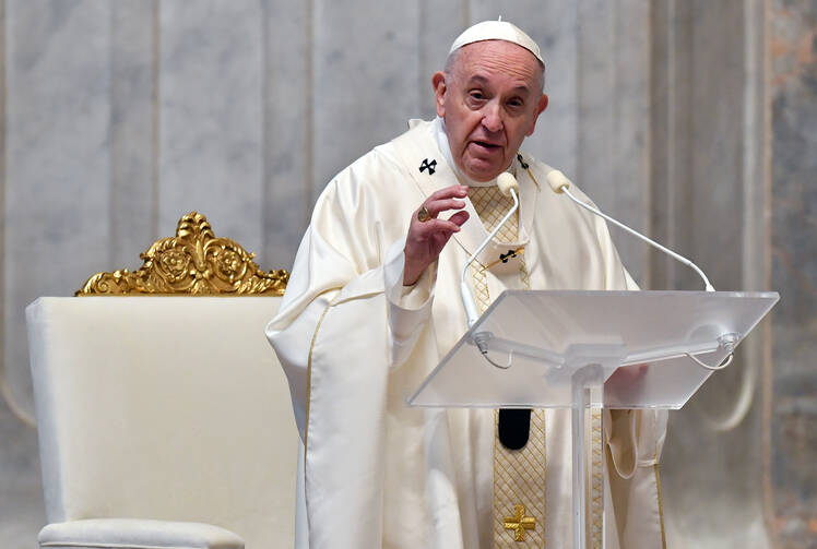 Pope Francis delivers the homily as he celebrates the Mass of Lord's Supper April 9, 2020, in St. Peter's Basilica at the Vatican. (CNS photo/Vatican Media via Reuters)
