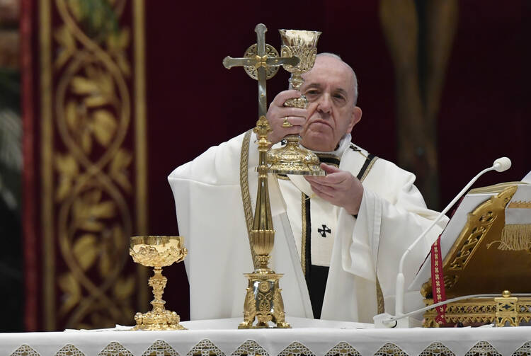 Pope Francis celebrates the Eucharist during Easter Mass in St. Peter's Basilica at the Vatican on April 12. The Mass was celebrated without the presence of the public due to the coronavirus pandemic. (CNS photo/Vatican Media)