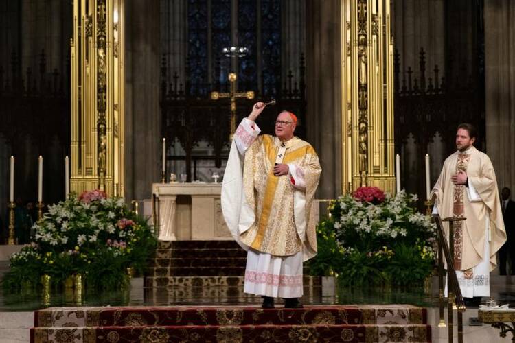 New York Cardinal Timothy M. Dolan celebrates Easter Mass at St. Patrick's Cathedral April 12, 2020, during the coronavirus pandemic. (CNS photo/Jeenah Moon, Reuters)