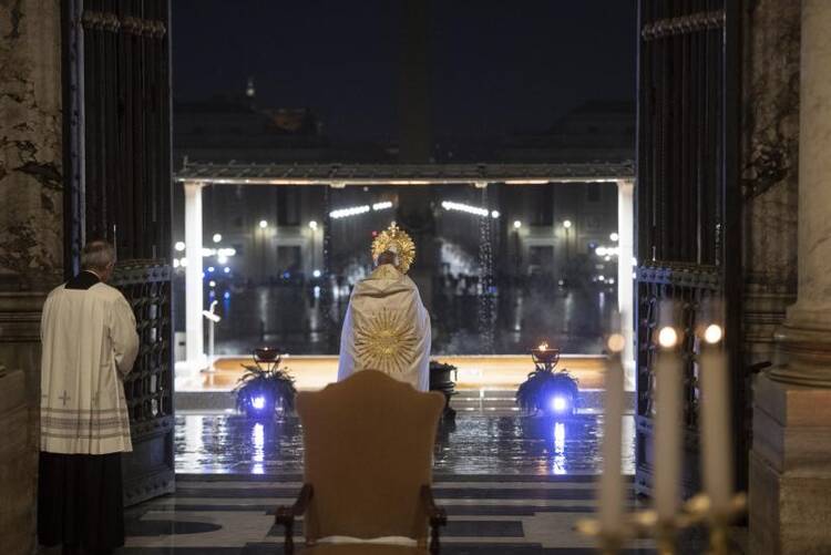 Pope Francis leads Benediction during a prayer service in an empty St. Peter's Square at the Vatican March 27, 2020. Although the pope usually draws large in-person crowds, during the COVID-19 pandemic his assemblies have reached the faithful through television, radio and the internet. (CNS photo/Vatican Media)