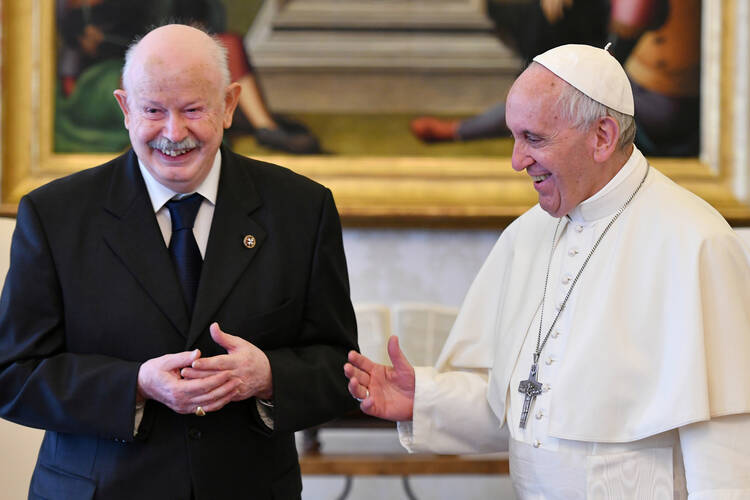 Fra' Giacomo Dalla Torre is seen smiling alongside Pope Francis in a 2017 file photo at the Vatican. (CNS photo/Alberto Pizzoli, pool via Reuters)