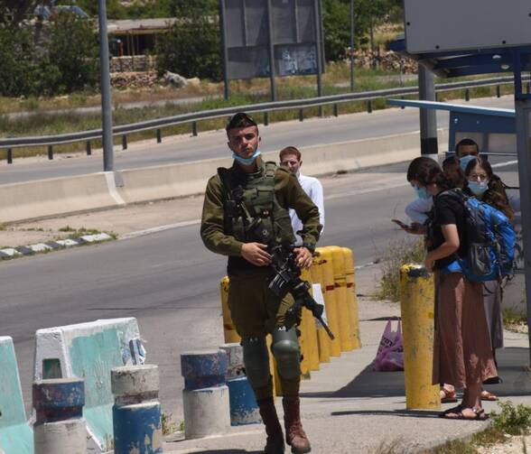 An Israeli soldier guards at the Gush Etzon Settlements junction near Bethlehem, West Bank, May 10, 2020. The settlements in the Gush Etzon region would be included in the proposed annexation plan by Israeli Prime Minister Benjamin Netanyahu. (CNS photo/Debbie Hill) 
