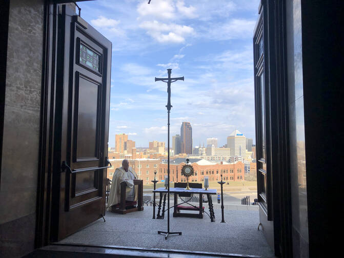 Archbishop Bernard A. Hebda of St. Paul and Minneapolis prays in front of the Blessed Sacrament at the Cathedral of St. Paul in St. Paul on March 27. (CNS photo/Dave Hrbacek, The Catholic Spirit)