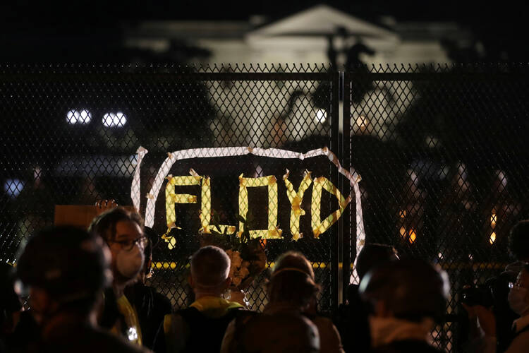 Demonstrators in Washington gather along the fence surrounding Lafayette Park outside the White House on June 2, 2020. (CNS photo/Jonathan Ernst, Reuters)