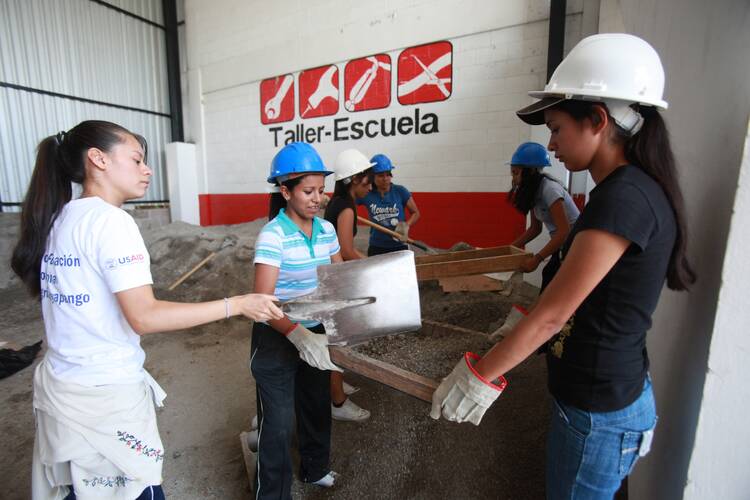 Young women put to work at a Fe y Alegria program in Soyapango, El Salvador. The training program is one of about 20 across Central America that partner with YouthBuild, a program of Catholic Relief Services that trains young people in various work skills so they can avoid emigrating. (CNS photo/Oscar Leiva, Silverlight for Catholic Relief Services)