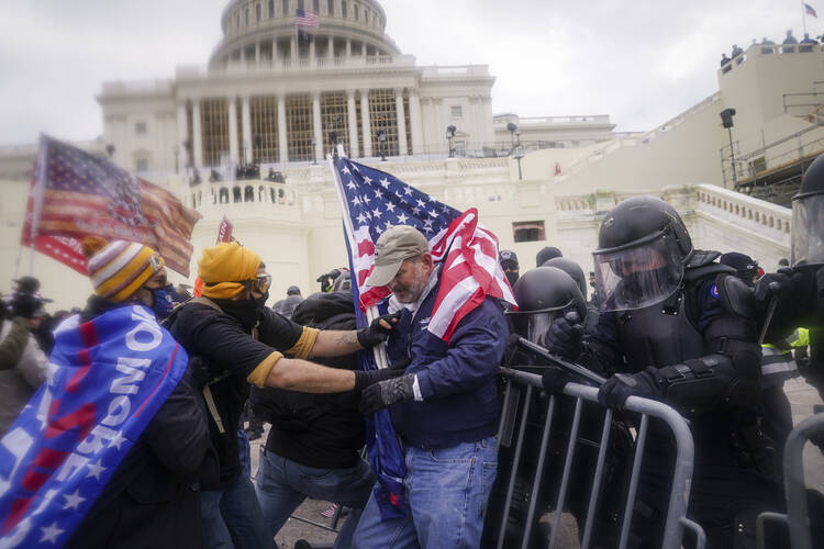 In the wake of the attack on the U.S. Capitol on Jan. 6, how can we achieve national unity and justice without being vengeful or dominative? (AP Photo/John Minchillo, File)