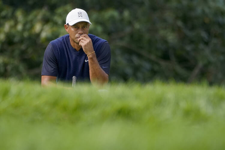 Tiger Woods, of the United States, waits to hit on the 13th hole during the first round of the US Open Golf Championship, Thursday, Sept. 17, 2020, in Mamaroneck, N.Y. (AP Photo/Charles Krupa)