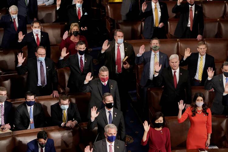 Republican members of the U.S. House of Representatives take their oath of office on the floor of the House Chamber during the first session of the 117th Congress on Capitol Hill in Washington on Jan. 3, 2021. (CNS photo/Joshua Roberts, Reuters)