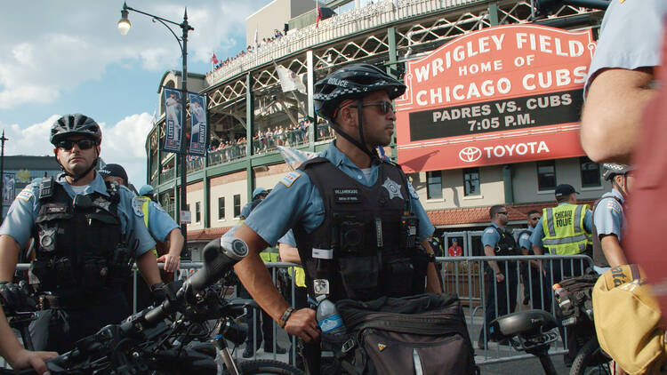 Police stand outside of Wrigley Field. (Chicago Story Film, LLC)