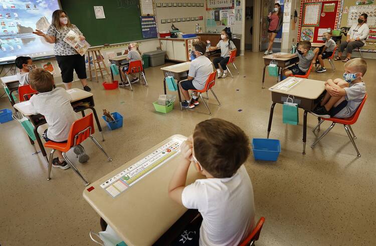 Students at Queen of the Rosary School in Elk Grove Village, Ill., are seen on Aug. 17, 2020, during the first week of school, as they follow the Archdiocese of Chicago's guidelines to prevent the spread of COVID-19. (CNS photo/Karen Callaway, Chicago Catholic)