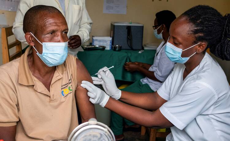 A man receives a vaccine against the coronavirus disease (COVID-19) at the Masaka hospital in Kigali, Rwanda, March 5, 2021. (CNS photo/Jean Bizimana, Reuters)