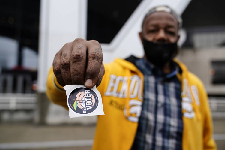 Gary Ragland, 64, votes for the first time during early voting in Atlanta on Oct. 28, 2020. (AP Photo/Brynn Anderson)