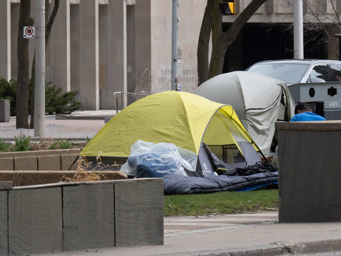 Homeless camp set up in park in middle of University Avenue in downtown Toronto by the Court House during Covid-19 pandemic on April 3, 2020.