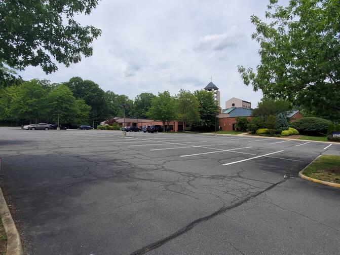 St. John Neumann Church, in Reston, Va., is typical of suburban parishes in the United States—many of which are required to maintain large parking areas by local zoning laws. (Addison Del Mastro) 