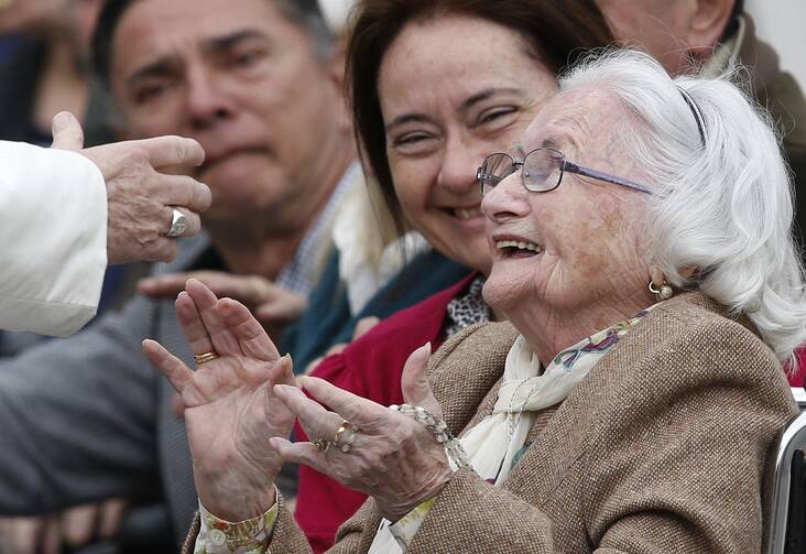 Elderly woman meets Pope Francis