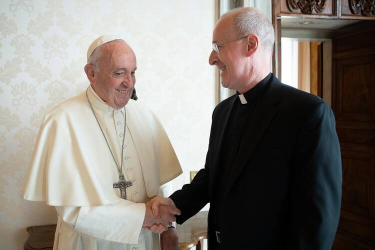 Pope Francis greets Jesuit Father James Martin, author and editor at large of America magazine, during a private meeting at the Vatican Oct. 1, 2019. (CNS photo/Vatican Media)