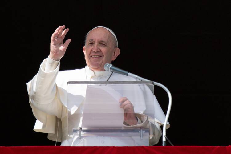 In this file photo, Pope Francis greets the crowd as he leads the Angelus from the window of his studio overlooking St. Peter's Square on Feb. 28, 2021. He is expected to recite the Angelus tomorrow from Gemelli Hospital. (CNS photo/Vatican Media)