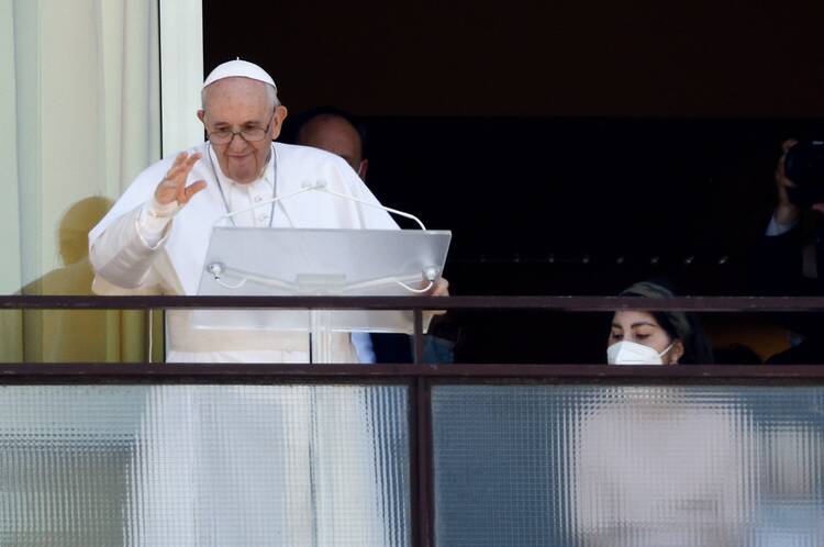 Pope Francis greets the crowd as he leads the Angelus from a balcony of Gemelli Hospital in Rome on July 11, 2021, as he recovers from intestinal surgery. (CNS photo/Guglielmo Mangiapane, Reuters)