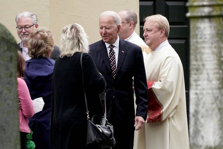 President Joe Biden speaks with people outside St. Joseph on the Brandywine Catholic Church in Wilmington, Del., on May 30, 2021. (CNS photo/Ken Cedeno, Reuters)