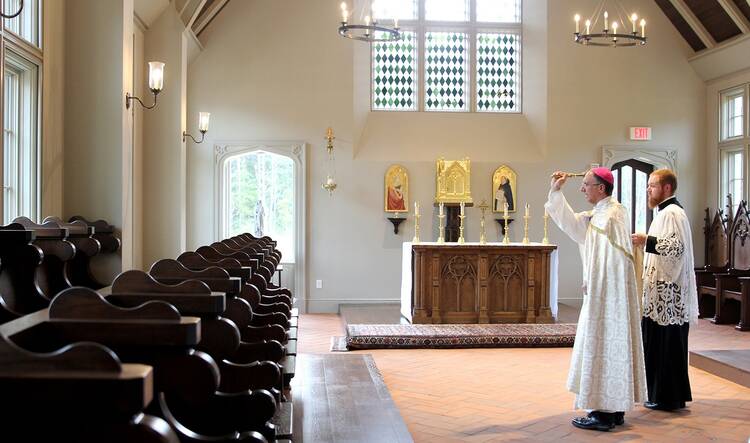 Bishop Peter J. Jugis of Charlotte, N.C., blesses the chapel inside the new St. Joseph College Seminary near Mount Holly, N.C., Sept. 15, 2020. Bishop Jugis has been a supporter of the Latin Mass in his diocese (CNS photo/SueAnn Howell, Catholic News Herald)