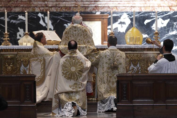 Cardinal Walter Brandmuller elevates the Eucharist during a Tridentine Mass at the Altar of the Chair in St. Peter's Basilica at the Vatican May 15, 2011. (CNS photo/Paul Haring)