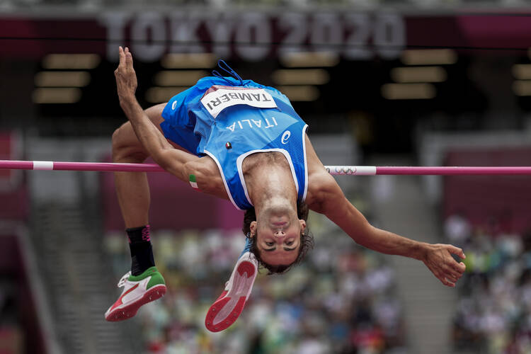 Gianmarco Tamberi, of Italy, competes in the preliminary round of the men's high jump at the 2020 Summer Olympics, Friday, July 30, 2021, in Tokyo. (AP Photo/David J. Phillip)