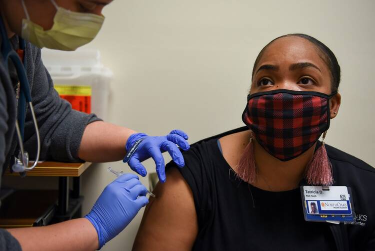 A woman receives a Covid-19 vaccine at North Oaks Medical Center in Hammond, La., Aug. 5, 2021. (CNS photo/Callaghan O'Hare, Reuters)