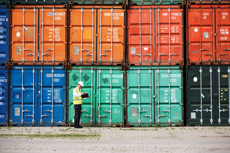 The development of the shipping container in the 1960s cut the cost of ocean shipping and permitted a colossal boom in global trade. (iStock/Yuri_Arcurs)