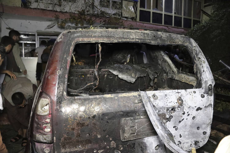 A destroyed vehicle is seen inside a house after a U.S. drone strike in Kabul, Afghanistan, on Aug. 29, 2021.  (AP Photo/Khwaja Tawfiq Sediqi)