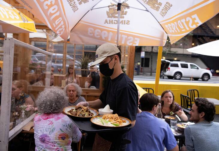 People eat at a restaurant in New York City Aug. 3, 2021, amid the coronavirus pandemic.