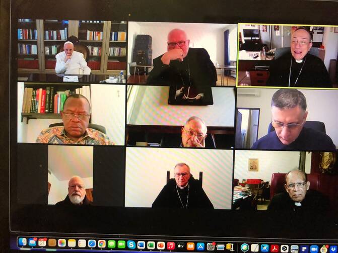 Pope Francis is pictured at top left on a television screen as he leads a virtual meeting of his Council of Cardinals from his residence at the Domus Sanctae Marthae at the Vatican Sept. 21, 2021. (CNS photo/Dicastery for Communication)