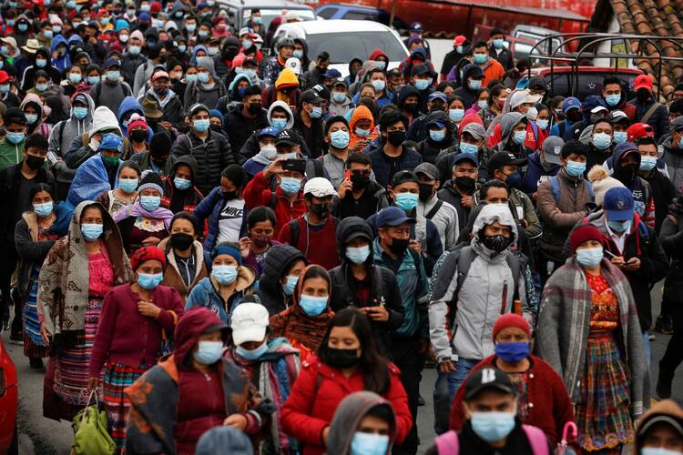 Guatemalans march during a protest demanding the resignation of President Alejandro Giammattei and Attorney General María Consuelo Porra in San Cristobal Totonicapan July 29, 2021. (CNS photo/Luis Echeverria, Reuters)