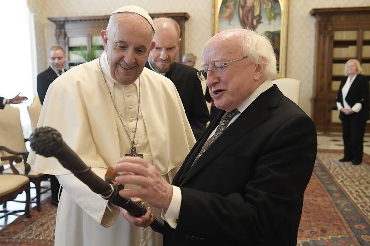 Pope Francis exchanges gifts with Irish President Michael Higgins during a private audience at the Vatican Sept. 17, 2021. (CNS photo/Vatican Media)