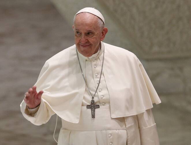 Pope Francis waves as he walks during his general audience on Sep. 29.